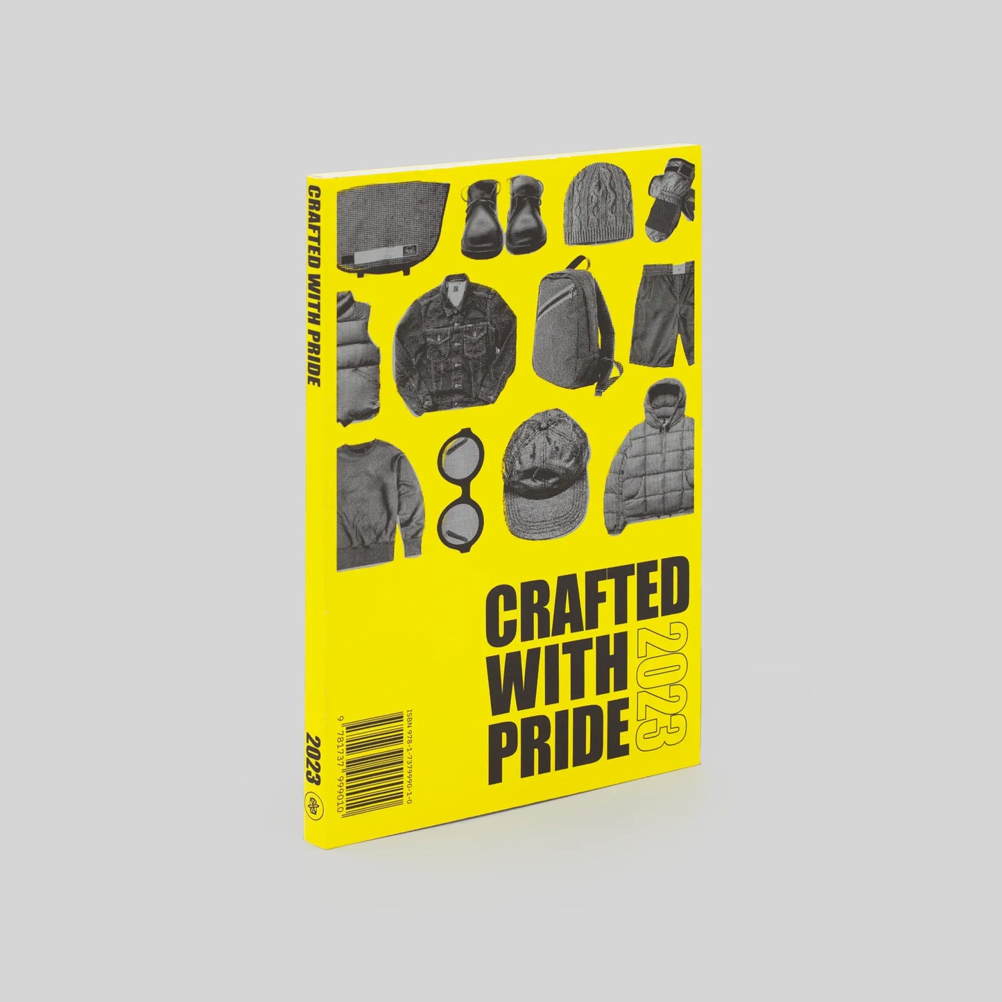 Cover of the book 'Crafted With Pride' 1st edition featuring a yellow background with black text and images showcasing various apparel items and the title of the book.